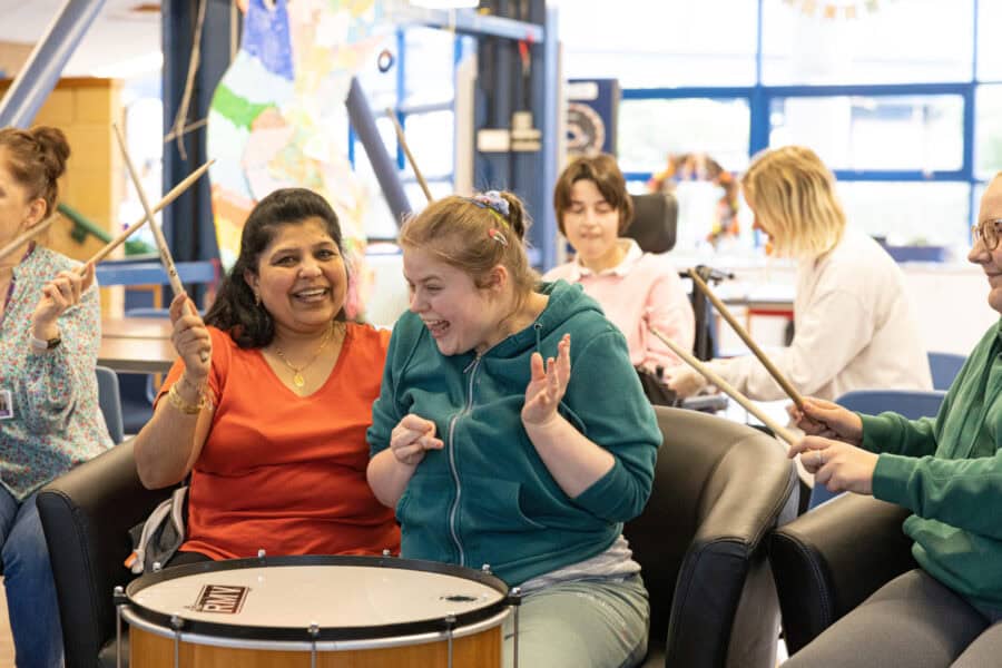 Lots of people enjoying drum practice