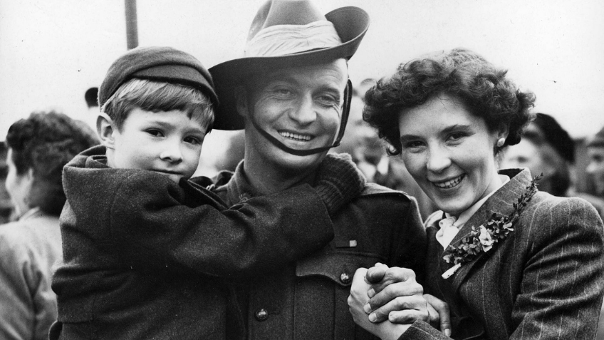 Black and white photo of couple with a child