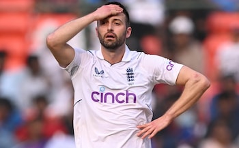 England's Mark Wood reacts as Axar Patel of India scores runs during day two of the first Test Match between India and England at Rajiv Gandhi International Stadium on January 26, 2024 in Hyderabad, India