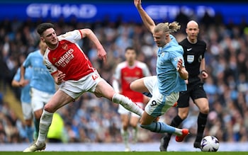 Erling Haaland is challenged by Declan Rice last season