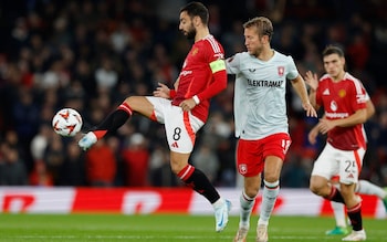 Manchester United's Bruno Fernandes controls the ball as FC Twente's Michel Vlap looks on