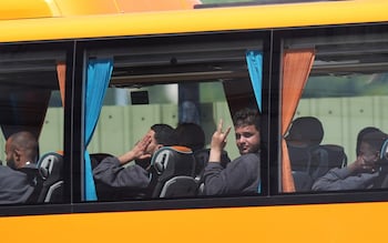 Migrants leaving the Border Force compound in Dover, Kent by bus following small boat crossings in the Channel on Friday