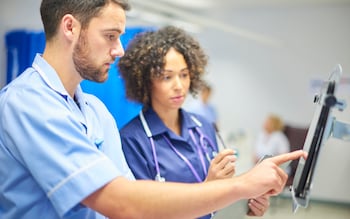 Doctors with computer