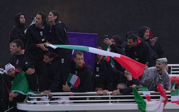 Gianmarco Tamberi carries the Italy flag at the opening ceremony for the Paris 2024 Olympic Games/Italian flagbearer apologises to wife after losing wedding ring in Seine during opening ceremony