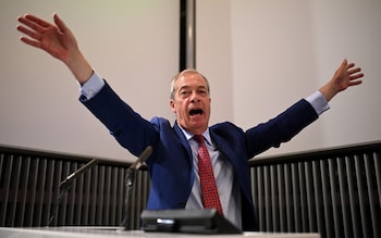 Reform UK leader and new MP for Clacton, reacts as a protester interrupts his presentation