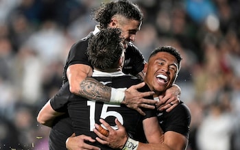 New Zealand's Beauden Barrett, left, celebrates with teammates after scoring a try against Argentina during their rugby test match at Eden Park, Auckland, New Zealand, on Saturday, Aug. 17, 2024