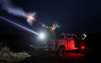 A Ukrainian serviceman from anti-drone mobile air defence unit fires a Browning machine gun at his position during combat, amid Russia's attack on Ukraine, in Chernihiv region, Ukraine March 28, 2024.