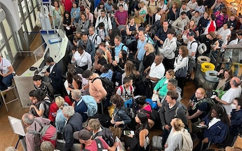 Passengers queuing at the Gare Du Nord train station in Paris, France