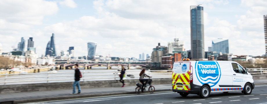 Thames van driving along a bridge in London