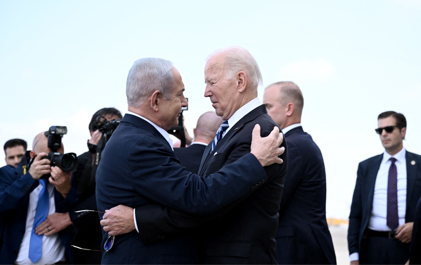 Israel Prime Minister Benjamin Netanyahu greets US President Joe Biden upon his arrival at Tel Aviv's Ben Gurion airport on October 18, 2023.