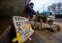 A homeless person and their dog on Princes Street, Edinburgh