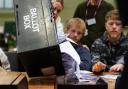 A ballot box is emptied (Peter Byrne/PA)