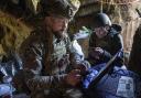 Ukrainian serviceman Andrii, left, of the  Air Assault Forces 148th separate artillery brigade,  sends receiving coordinates for a Furia drone at the frontline in Donetsk region, Ukraine