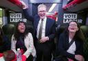 Labour Party leader Sir Keir Starmer talking to journalists on the Labour battle bus while on the General Election campaign trail