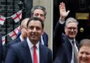 Keir Starmer waves outside an England-decorated Downing Street as Scottish Labour MPs visit