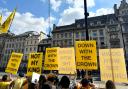 Protesters gathered as the king arrived for the State Opening of Parliament