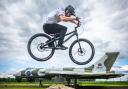 Cycling stunt team The Clan practice ahead of 360 Fest at the National Museum of Flight