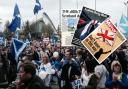 Yes activists protest outside BBC Scotland ahead of the 2014 referendum, and three papers' front pages from the day of the historic vote