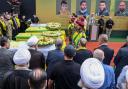 Hezbollah fighters and mourners attend a funeral of people killed after hundreds of paging devices exploded in a deadly wave across Lebanon