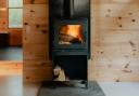 The Scottish Government has reversed a ban on wood-burning stoves in new-build homes