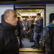 Commuters on a train into Glasgow Central.