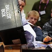 A ballot box is emptied (Peter Byrne/PA)