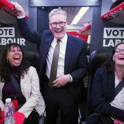 Labour Party leader Sir Keir Starmer talking to journalists on the Labour battle bus while on the General Election campaign trail