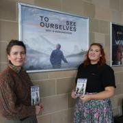 Director Jane McAllister, left, in front of the To See Ourselves poster