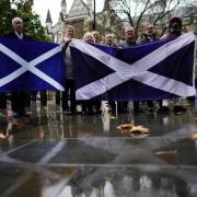 SNP campaigners outside the Supreme Court in London ahead of its independence referendum ruling in late 2022