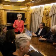 President of the European Commission, Ursula von der Leyen, center, onboard a train in Poland