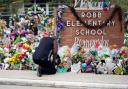 A man pays his respects a memorial at Robb Elementary School in Uvalde, Texas (Eric Gay/AP)