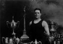 Champion swimmer Jack Hatfield pictured in his heyday with his many trophies.