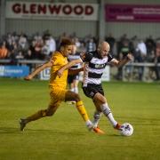 Darlington's Will Hatfield on the ball during a midweek evening game last season against Boston United