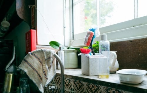 A cloth hangs over a tap in a suburban kitchen.