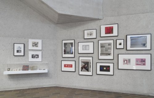 Geometric designs are hung against a concrete wall at the Anni and Josef Albers exhibition at the NGA in Canberra.