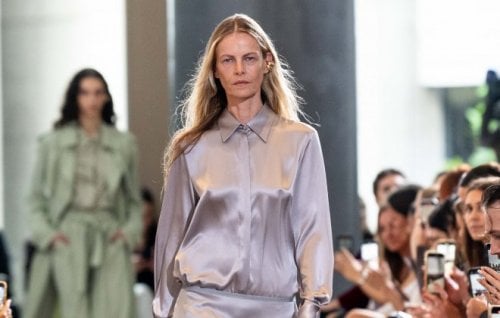 A model walks down the runway in a silk, taupe shirt at Viktoria & Woods' show at Australian Fashion Week.