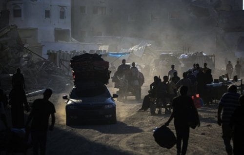 Displaced Palestinians flee areas of east Khan Younis after the Israeli army issued a new evacuation order.