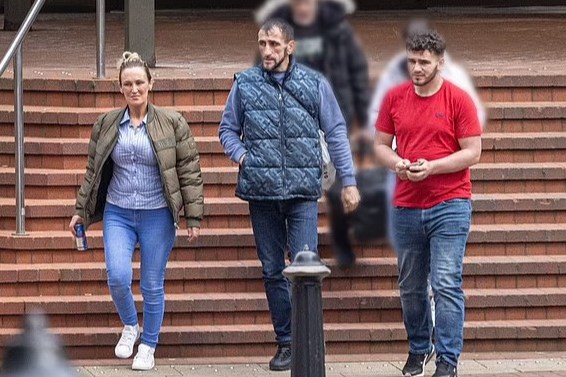 a group of people are walking down a set of stairs