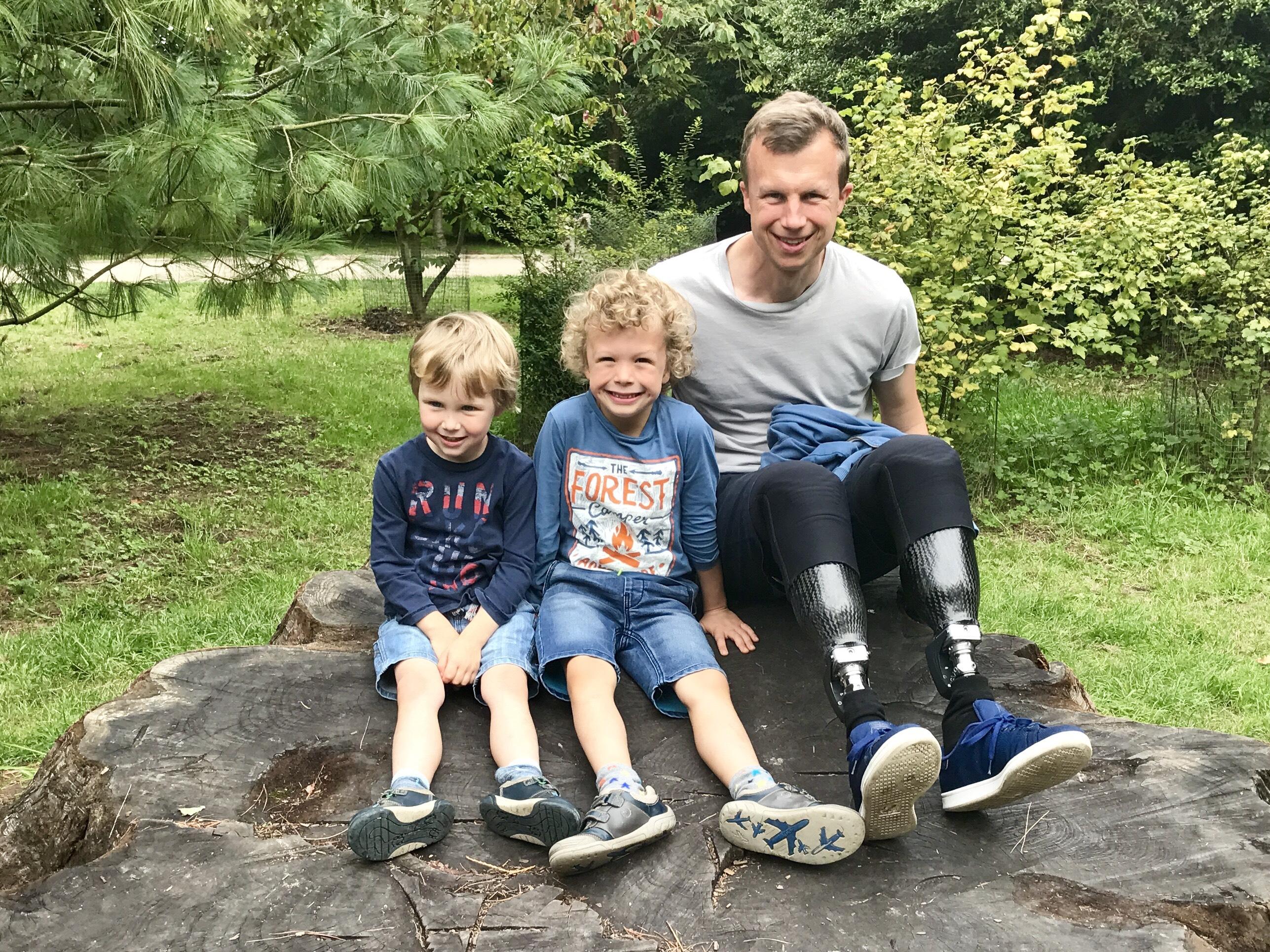  Dad Philip Fielding, pictured with his sons, developed sepsis back in 2016 and had to have both his legs amputated below the knee