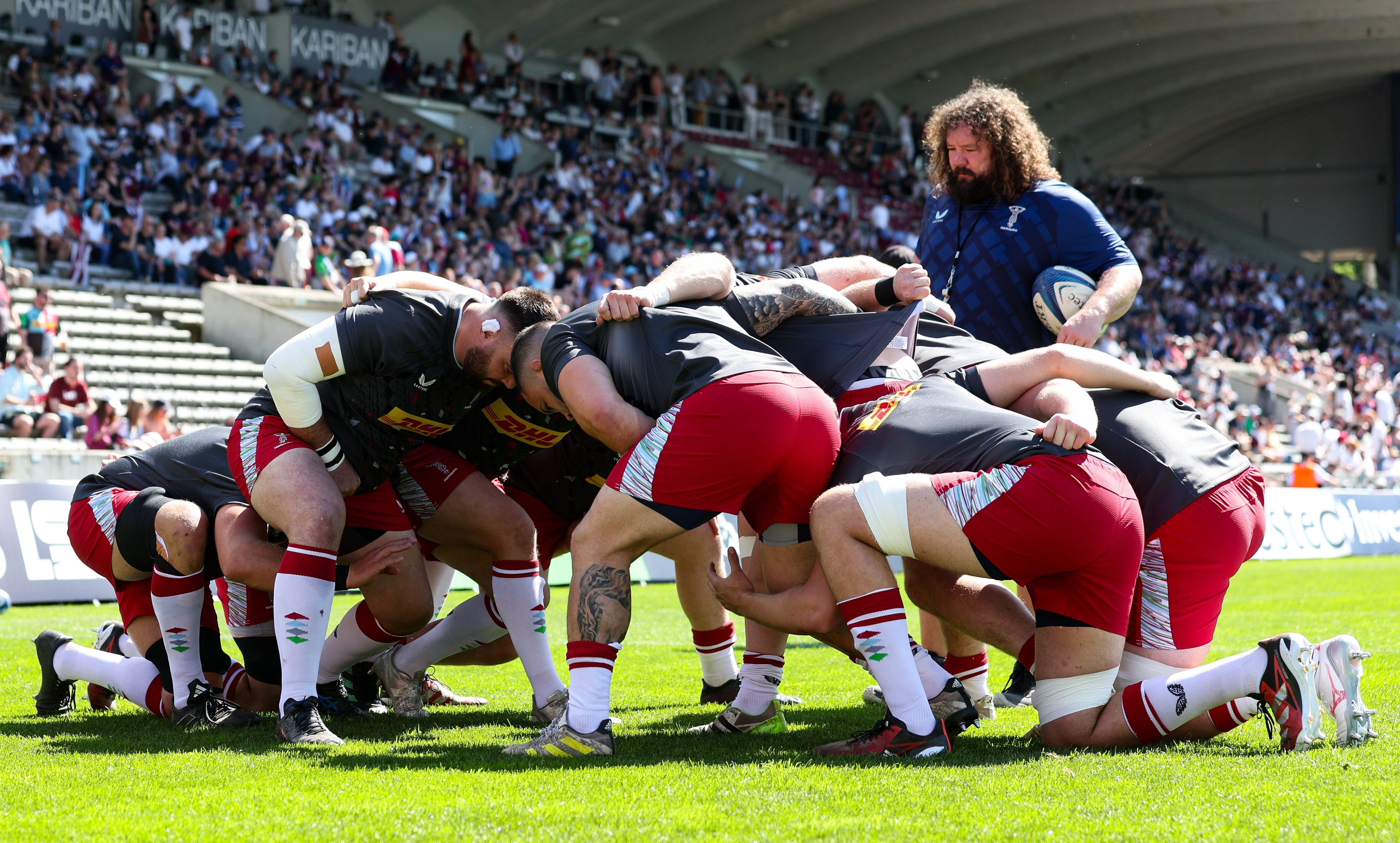 Jones keeps a close eye on the Quins scrum as they warm up before their stunning win in Bordeaux last weekend