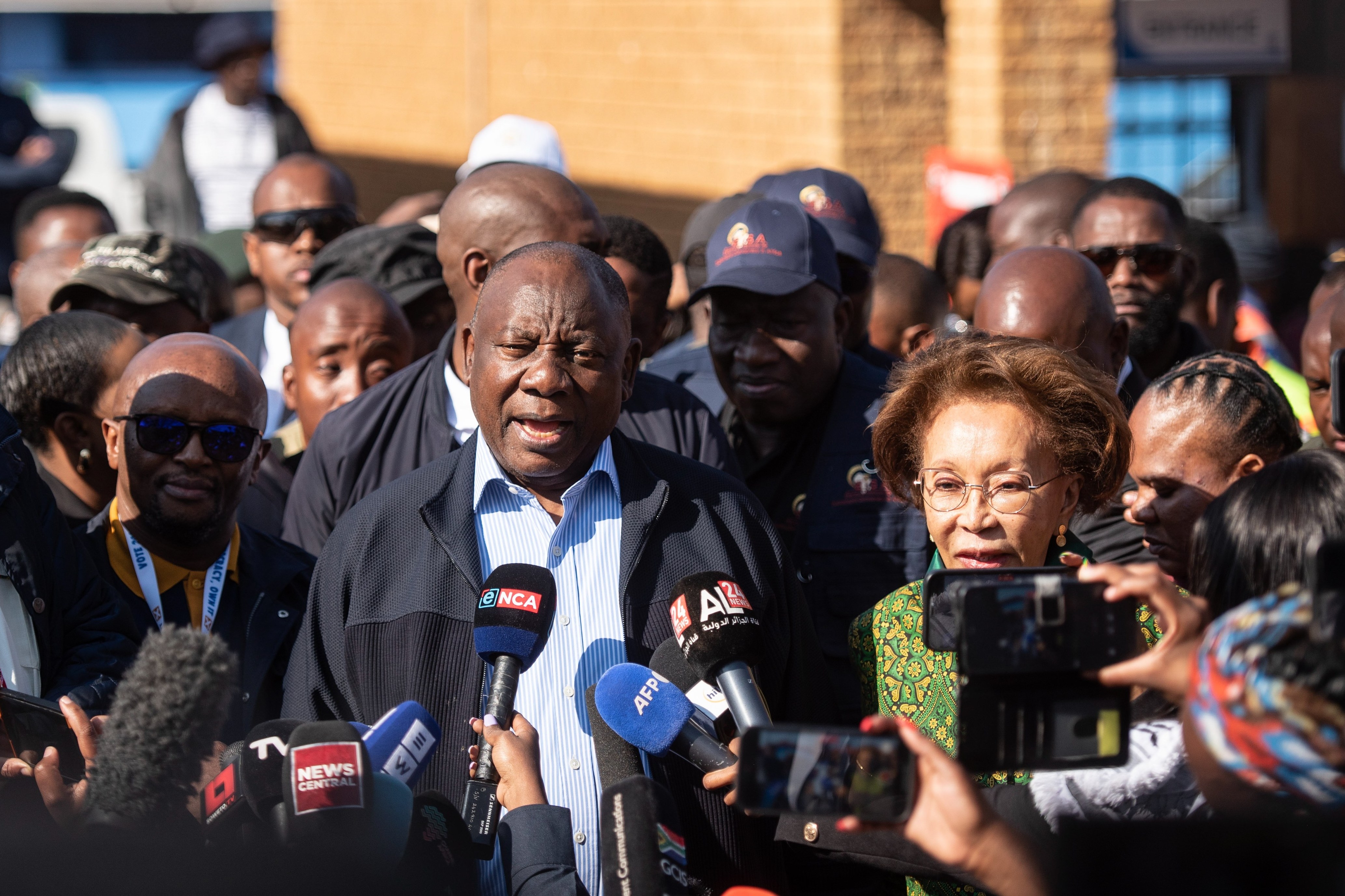 President Ramaphosa outside Hitekani Primary School in Soweto township after casting his ballot. Polls suggest his ANC party may stay above 45 per cent of the vote