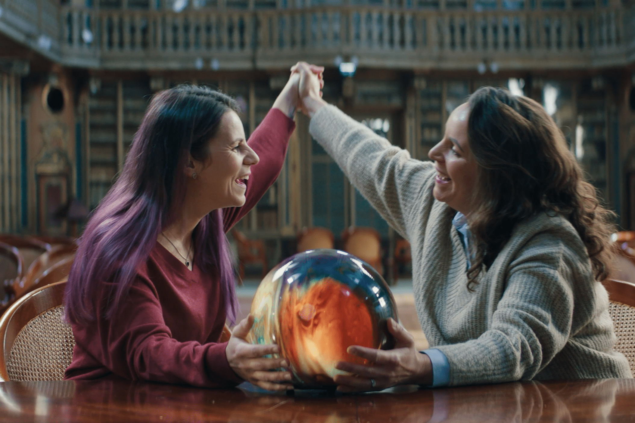 Laura Whitaker, left, who has Usher Syndrome, and Hannah Stroud, her sister, relive a childhood memory of singing to Coldplay’s song Fix You with the help of a specially designed sound and vibrations globe