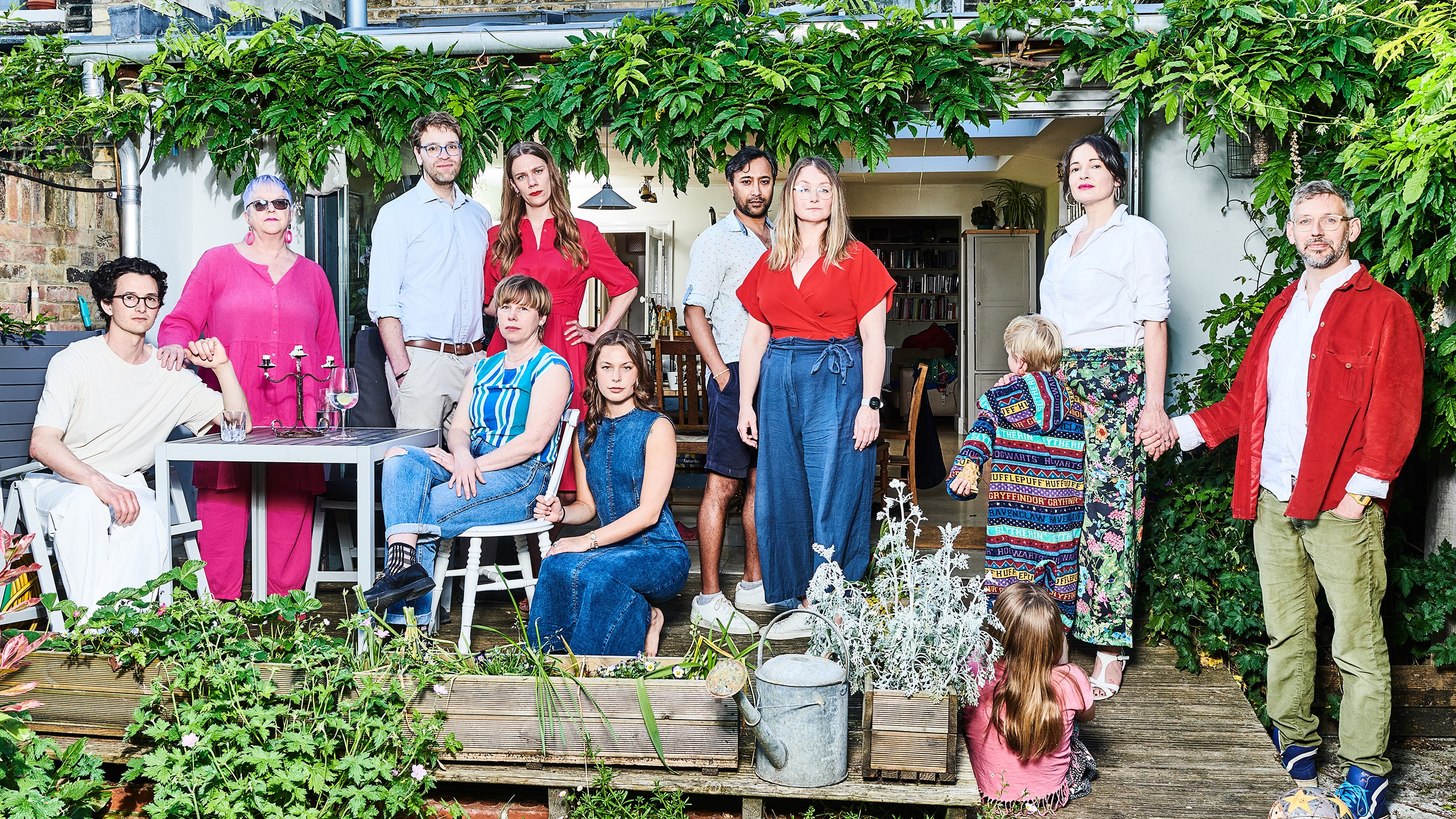 Elizabeth Oldfield, right, with her husband, Chris, and their two children, and co-owners Ramsey and Hatty El-Khazen (third and fourth from left), with honorary housemates, from left, Charlie Gilmour, Juliet Barclay, Erin Plunkett, Hannah Murray, Rhik Samadder and Leanne Sedin, at home in south London