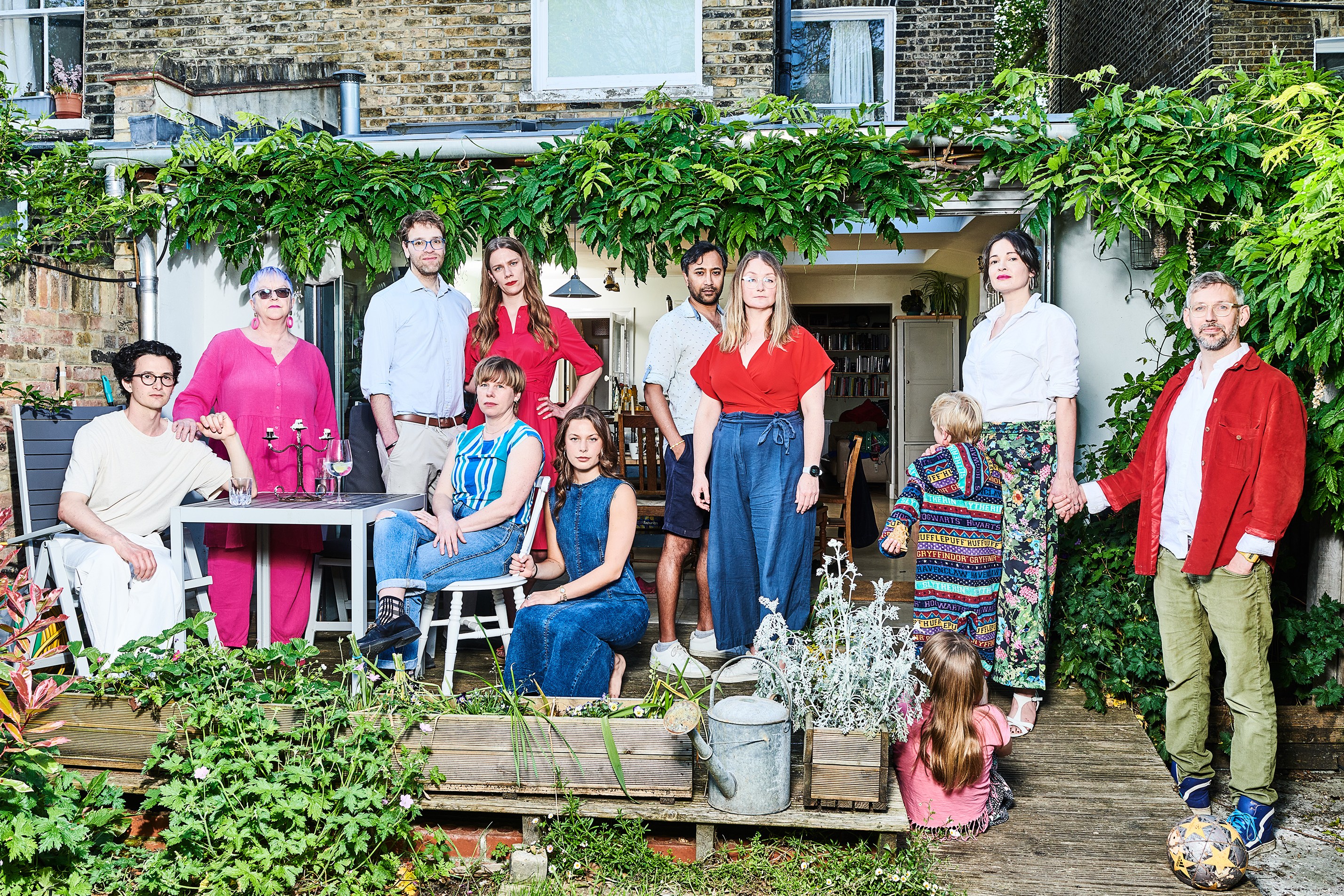 Elizabeth Oldfield, right, with her husband, Chris, and their two children, and co-owners Ramsey and Hatty El-Khazen (third and fourth from left), with honorary housemates, from left, Charlie Gilmour, Juliet Barclay, Erin Plunkett, Hannah Murray, Rhik Samadder and Leanne Sedin, at home in south London