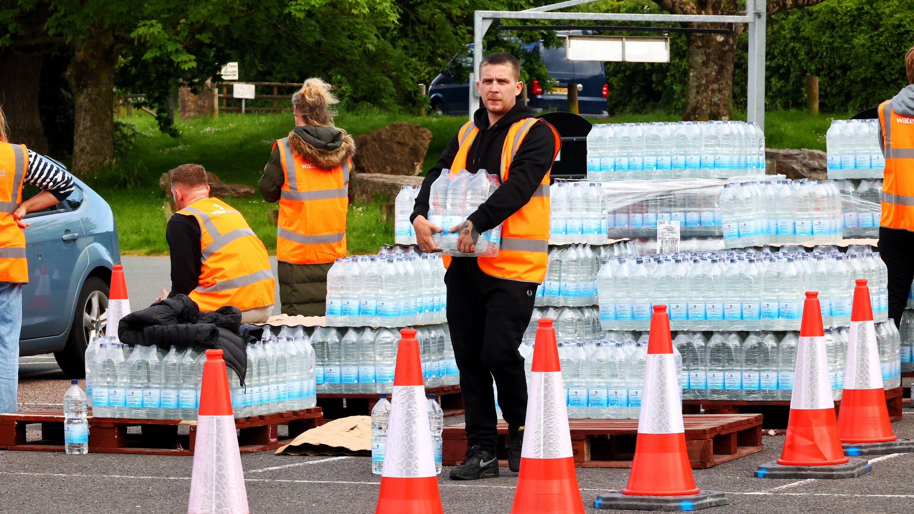 South West Water gave out emergency rations of bottled water to affected customers, leading to mile-long queues