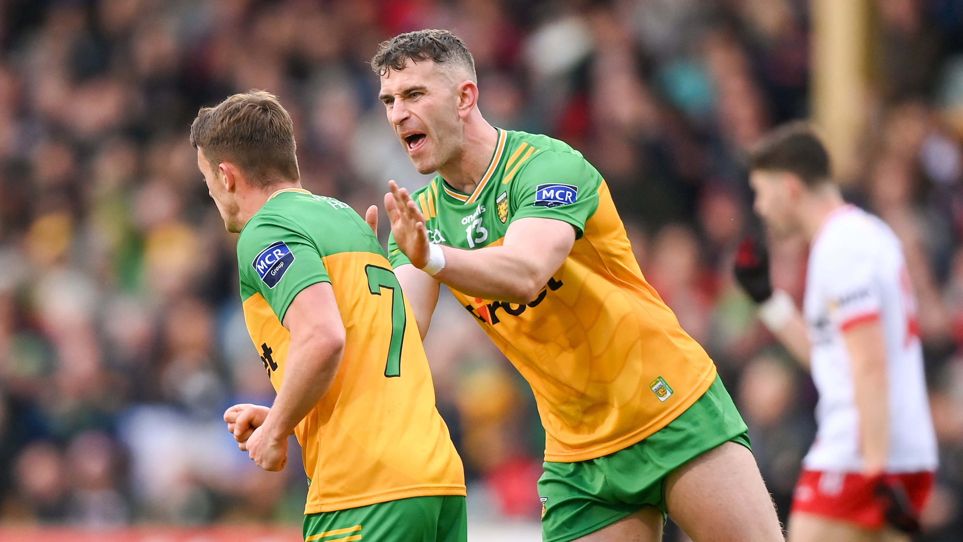 Patrick McBrearty congratulates Mogan, who scored three points for Donegal
