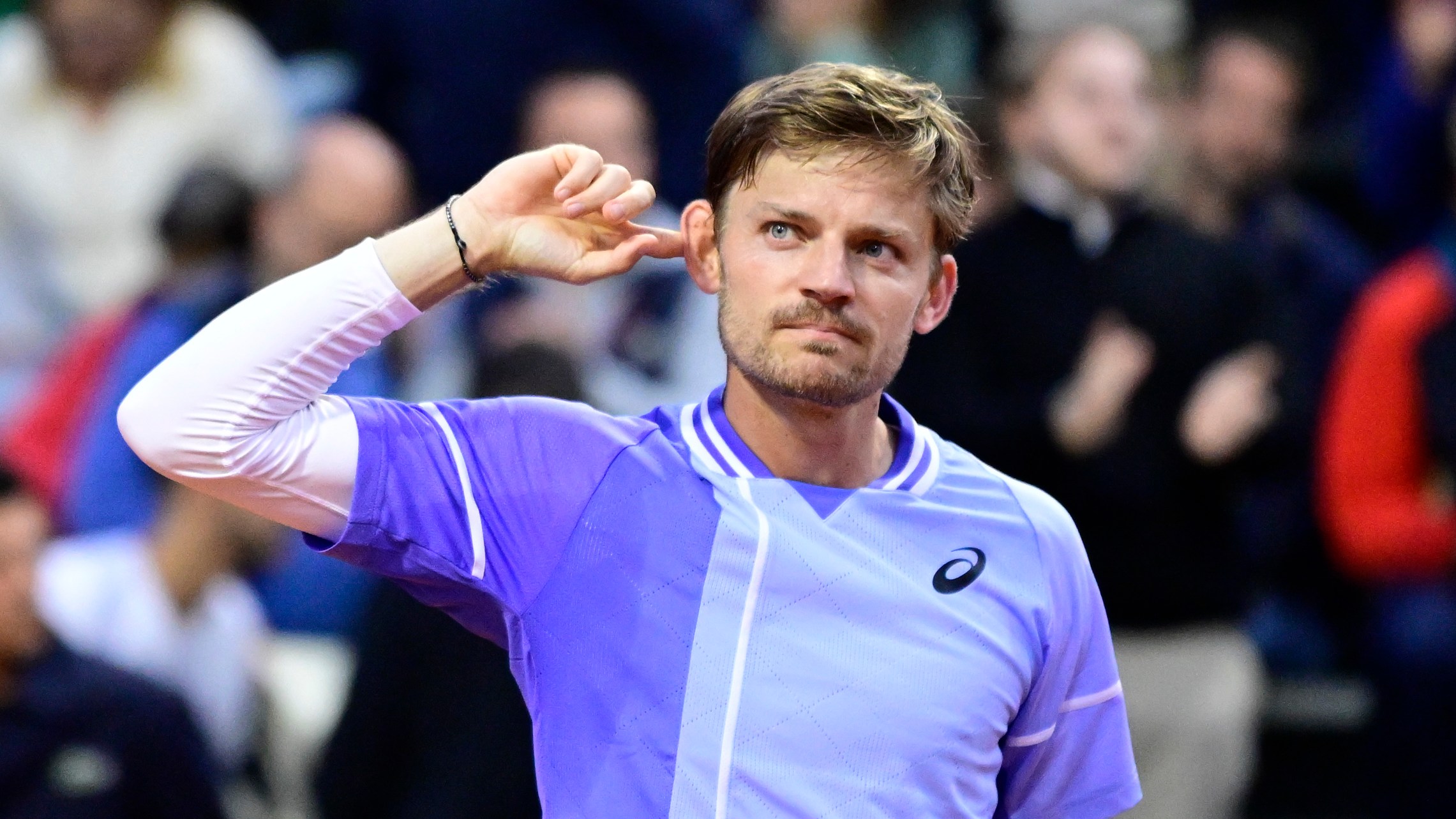 A frustrated Goffin gestures to the crowd after facing abuse during his hard-fought win against Mpetshi Perricard