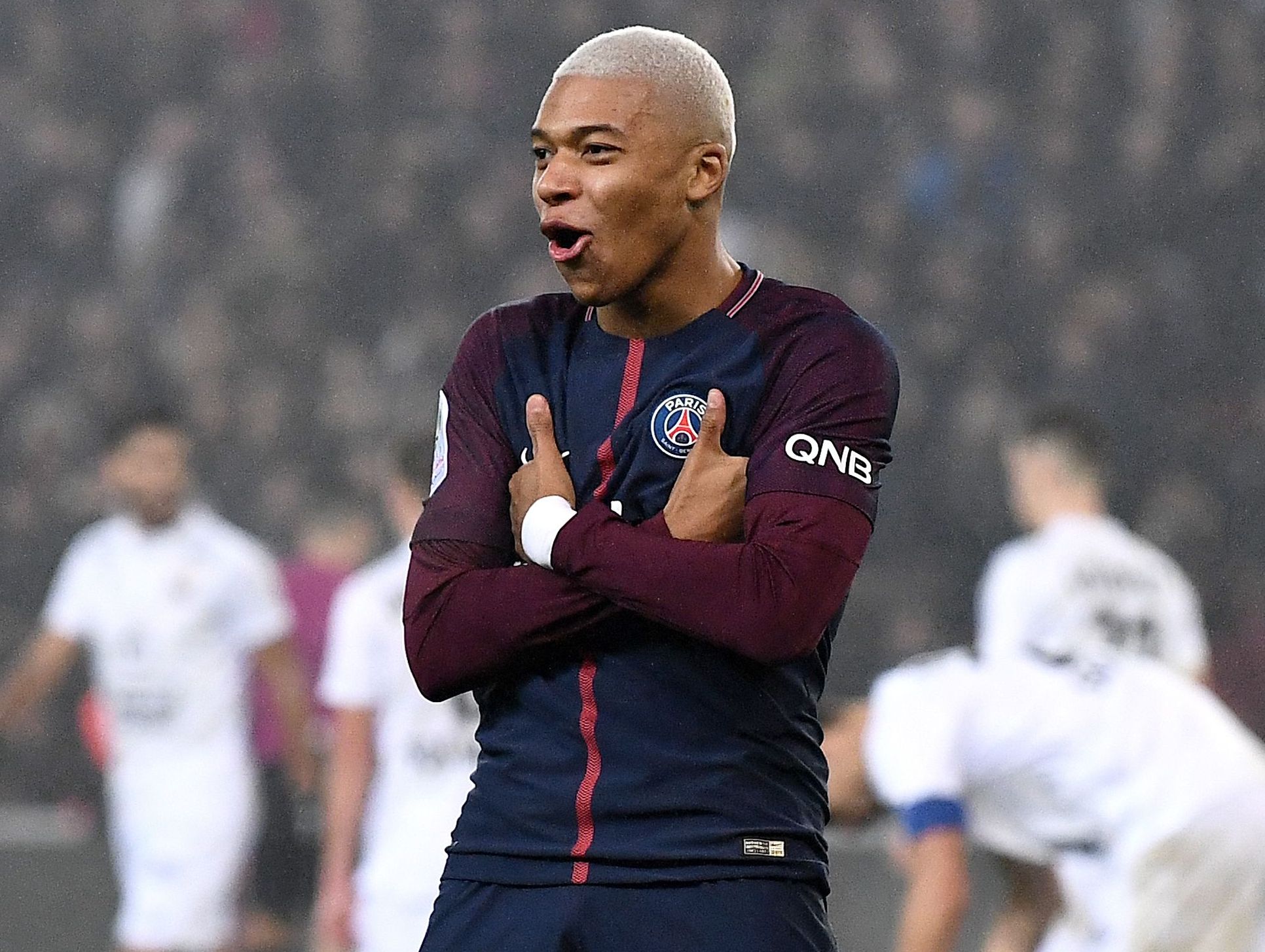 Kylian Mbappé demonstrates the crossed-arm celebration he is attempting to trademark after scoring for Paris Saint-Germain