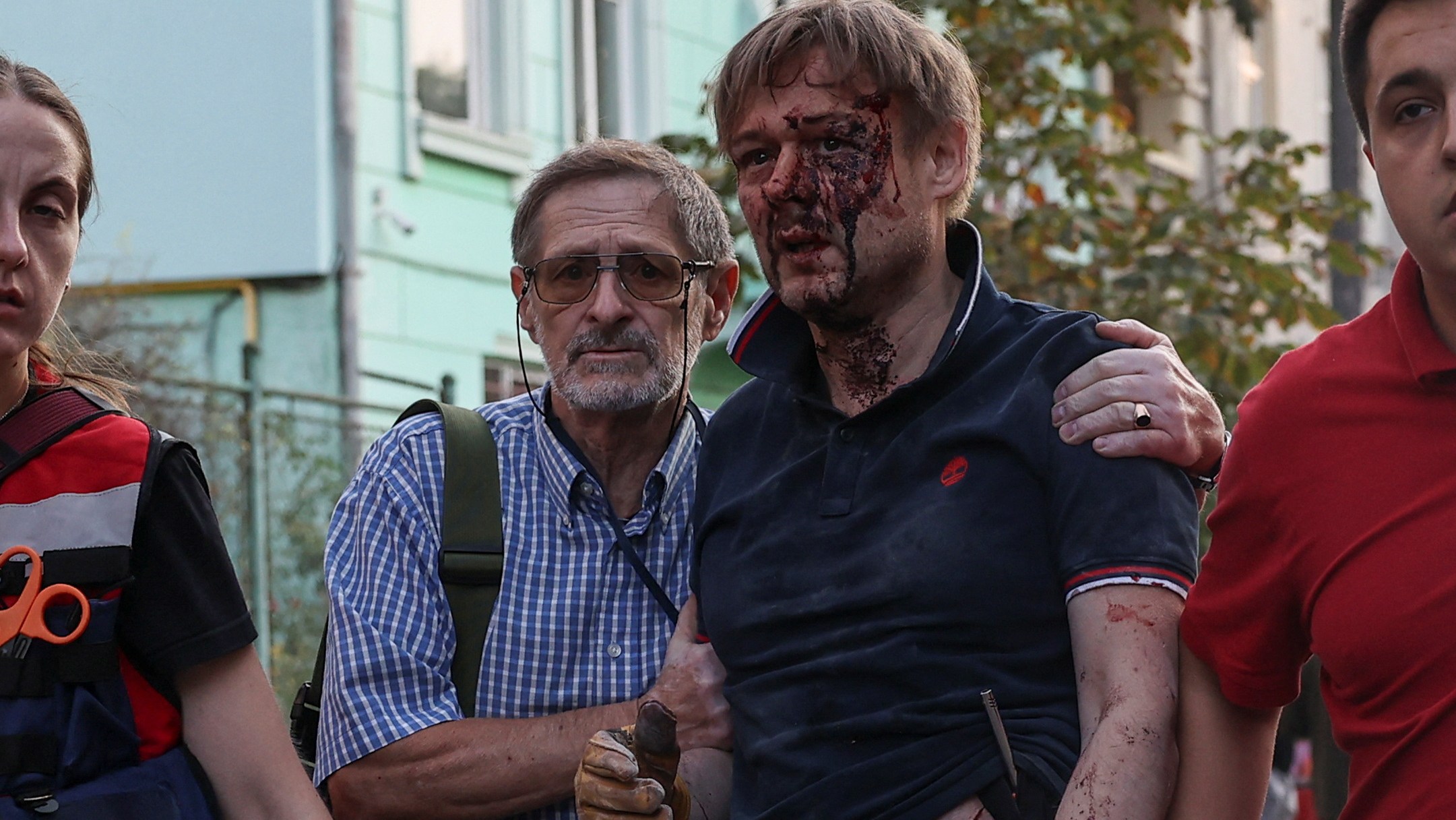 Yaroslav Bazylevych is helped to safety in Lviv. He was metres away when a Russian missile hit the family apartment