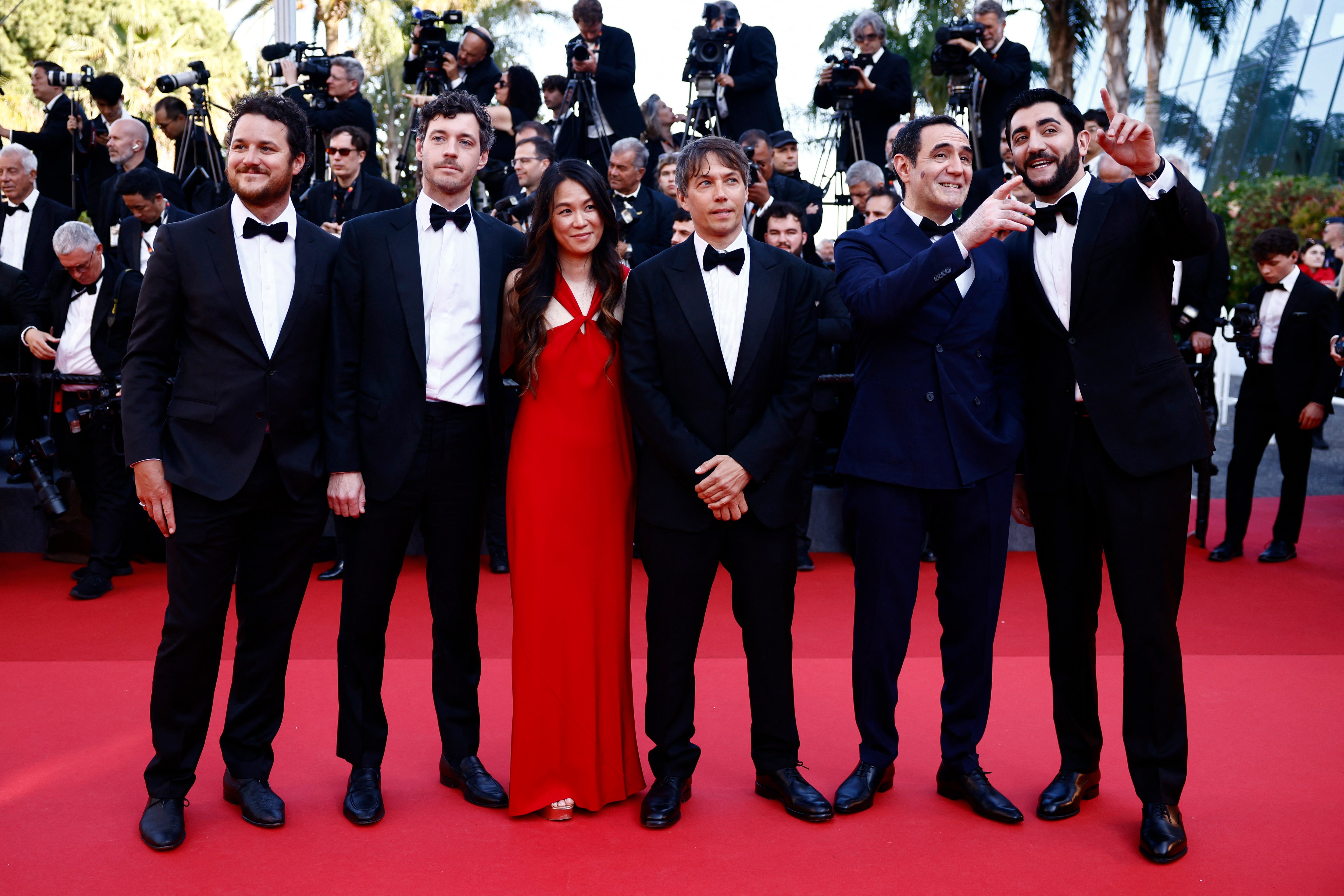 Sean Baker, Mikey Madison and the team of Anora on the Cannes red carpet